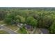 Aerial shot featuring the home, its lush surroundings, and neighborhood at 801 Williamsboro St, Oxford, NC 27565