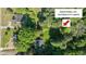 Aerial view showcasing the property's additional lot outside city limits with lush greenery at 801 Williamsboro St, Oxford, NC 27565