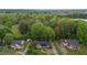 Overhead view of the property with surrounding trees and neighboring homes at 801 Williamsboro St, Oxford, NC 27565