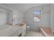 Retro style bathroom featuring a pink sink and bathtub, white tile walls, and a large window at 801 Williamsboro St, Oxford, NC 27565