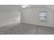 Neutral bedroom space has gray carpeting and white walls, plus a window for beautiful natural light at 801 Williamsboro St, Oxford, NC 27565