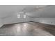 Bright bonus room featuring hardwood floors, ceiling fans, and windows for ample natural light at 801 Williamsboro St, Oxford, NC 27565