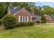 A well-kept brick home with solar panels and white trim at 801 Williamsboro St, Oxford, NC 27565