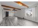 Open living room features hardwood style floors, a ceiling fan, and natural light at 801 Williamsboro St, Oxford, NC 27565