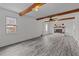 Spacious living room showcasing new flooring, fireplace, exposed ceiling beams and natural light at 801 Williamsboro St, Oxford, NC 27565
