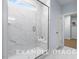 Clean bathroom with marble shower and built-in seat at 71 Priming Way, Angier, NC 27501