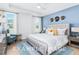 Spacious primary bedroom with large bed and sitting area at 71 Priming Way, Angier, NC 27501