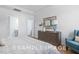 Bright bedroom with dresser and comfy armchair at 71 Priming Way, Angier, NC 27501