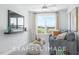 Cozy living room with comfy sofa and large window at 71 Priming Way, Angier, NC 27501