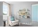 Charming reading nook with comfy chair and bookshelves at 71 Priming Way, Angier, NC 27501