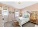 Charming bedroom with a white bed frame and botanical art at 101 Copper Leaf Ave, Chapel Hill, NC 27516