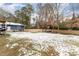 Spacious backyard with shed, gazebo, and partially covered in snow at 1012 Maple Ave, Apex, NC 27502