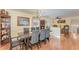 Charming dining room with hardwood floors, chandelier, and a large wooden table at 1012 Maple Ave, Apex, NC 27502