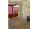 Elegant dining room featuring hardwood floors and a lovely chandelier at 108 Cheney Ct, Garner, NC 27529