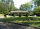 Charming single-story home with a well-manicured lawn and mature trees at 108 Cheney Ct, Garner, NC 27529
