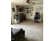 Cozy living room with fireplace, built-in shelving, and a large TV at 108 Cheney Ct, Garner, NC 27529