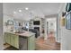 Open concept kitchen with island and living room view at 108 Somerset Ct, Mebane, NC 27302