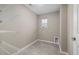 Bright laundry room with washer, dryer hookups, and ample shelving at 1110 Freestone Rd, Durham, NC 27703