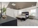 Spacious main bedroom with dark wood furniture, a stylish chandelier, and a dark ceiling at 1110 Freestone Rd, Durham, NC 27703