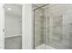 Modern bathroom with a glass shower enclosure and grey tile at 1111 Freestone Rd, Durham, NC 27703