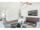 Living room with large TV, comfortable seating and hardwood floors at 1111 Freestone Rd, Durham, NC 27703