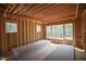 Bright unfinished bedroom space with large windows for natural light and wooden framing under construction at 1236 Perry Bluff Dr, Wake Forest, NC 27587