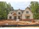 Charming two-story home features brick accents, large windows, and a welcoming front porch under construction at 1236 Perry Bluff Dr, Wake Forest, NC 27587