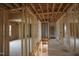Upstairs shows wooden framing, open floor plan, and natural light pouring in to the unfinished space at 1236 Perry Bluff Dr, Wake Forest, NC 27587