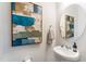 Small bathroom with pedestal sink and modern decor at 1267 Willow Tree Way, Graham, NC 27253