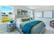 Bright bedroom with wood bed frame and teal bedding at 1267 Willow Tree Way, Graham, NC 27253