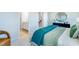 Spacious bedroom with en-suite bathroom and teal bedding at 1267 Willow Tree Way, Graham, NC 27253