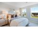 Bright bedroom with large windows and stylish decor at 1267 Willow Tree Way, Graham, NC 27253