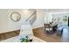 Dining area with a rustic wood table and hardwood floors at 1267 Willow Tree Way, Graham, NC 27253