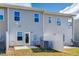 Modern townhouse exterior with private patio and fenced yard at 1267 Willow Tree Way, Graham, NC 27253