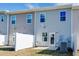 Rear view of townhouses with private fenced yards at 1267 Willow Tree Way, Graham, NC 27253