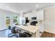 Modern kitchen with white cabinets and stainless steel appliances at 1267 Willow Tree Way, Graham, NC 27253