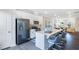 Open concept kitchen with island and stainless steel appliances at 1267 Willow Tree Way, Graham, NC 27253
