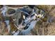An aerial view of a large house with a large backyard. The house is two stories, light-colored, and has a large roof at 1313 Enderbury Dr, Raleigh, NC 27614