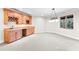 Basement wet bar with wooden cabinetry and wine rack at 1313 Enderbury Dr, Raleigh, NC 27614