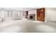 Finished basement with stone fireplace and built-in wooden shelving units at 1313 Enderbury Dr, Raleigh, NC 27614