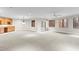 Large basement recreation room with wet bar and access to the backyard at 1313 Enderbury Dr, Raleigh, NC 27614
