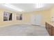 Basement workshop with a workbench, cabinets, and large windows at 1313 Enderbury Dr, Raleigh, NC 27614