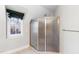 Bathroom with a large glass shower and window at 1313 Enderbury Dr, Raleigh, NC 27614