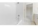 Clean bathroom with white tile and bathtub at 1313 Enderbury Dr, Raleigh, NC 27614