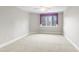 Well-lit bedroom with carpeted floor and window at 1313 Enderbury Dr, Raleigh, NC 27614