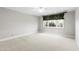 Spacious bedroom with carpeted floor and large window at 1313 Enderbury Dr, Raleigh, NC 27614