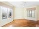Bright bedroom with hardwood floors and large windows offering scenic views at 1313 Enderbury Dr, Raleigh, NC 27614