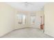 Bright and airy bedroom with carpeted floors and large windows at 1313 Enderbury Dr, Raleigh, NC 27614