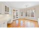 Breakfast nook with built-in desk and access to screened porch at 1313 Enderbury Dr, Raleigh, NC 27614