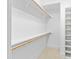 Walk-in closet with shelves and hanging rods at 1313 Enderbury Dr, Raleigh, NC 27614